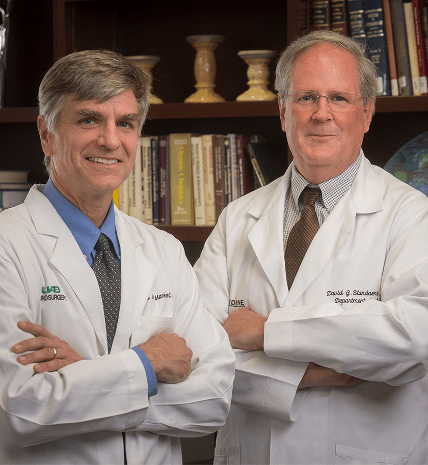 Two UAB doctors in white coats